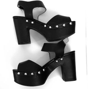 Black platform sandals with gold studs